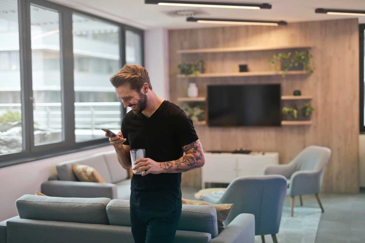 Man on his phone indoors