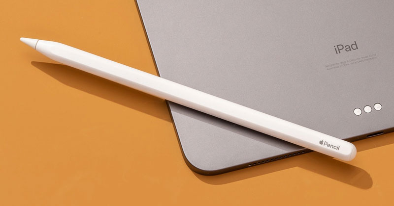 Apple Pencil resting on an iPad