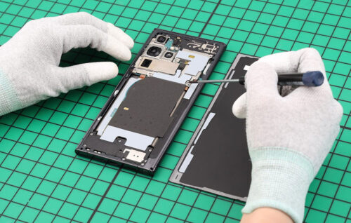 Samsung Galaxy phone being repaired by a technician